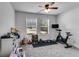 Bedroom featuring a workout bike and toy-filled shelves at 245 Raleigh Way, Villa Rica, GA 30180