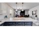 Bright, open kitchen with pendant lighting and a view into the dining and living areas at 245 Raleigh Way, Villa Rica, GA 30180