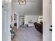 Open-concept living room with neutral carpet and view of the kitchen and hallway at 245 Raleigh Way, Villa Rica, GA 30180