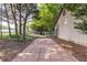 Charming backyard path leads to a white fence, lush greenery, and scenic outdoors at 2753 Fireside Se Ct, Marietta, GA 30067
