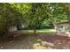 Lush backyard features mature trees, a shed, and a screened-in porch at 2753 Fireside Se Ct, Marietta, GA 30067