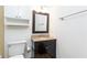 Bathroom featuring a black vanity with granite countertops and large mirror at 2753 Fireside Se Ct, Marietta, GA 30067