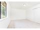 Bright, neutral bedroom with carpet and closet space offers a calm, inviting atmosphere at 2753 Fireside Se Ct, Marietta, GA 30067