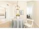 Charming dining area with a round table, elegant lighting, and seamless transition to other rooms at 2753 Fireside Se Ct, Marietta, GA 30067