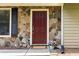 Close-up of front door with stone veneer, decorative black shutters, and a welcoming entryway at 2753 Fireside Se Ct, Marietta, GA 30067