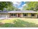 Charming single-story home with stone accents, neutral siding, and a well-maintained front yard at 2753 Fireside Se Ct, Marietta, GA 30067