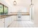 Bright kitchen with white cabinets, stainless steel appliances, and tile flooring at 2753 Fireside Se Ct, Marietta, GA 30067