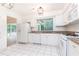 Bright kitchen with white cabinets, stainless steel appliances, granite countertops, and tile flooring at 2753 Fireside Se Ct, Marietta, GA 30067