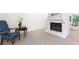 Cozy living room showcasing a stone fireplace, comfortable seating, and neutral carpeting at 2753 Fireside Se Ct, Marietta, GA 30067
