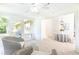 Bright sunroom showcasing wicker chairs, natural light, and an open connection to the dining area at 2753 Fireside Se Ct, Marietta, GA 30067