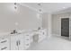 Modern bathroom with dual vanities, stone countertops, and contemporary lighting at 37 Deer Canyon Dr, Auburn, GA 30011