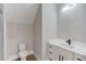 Half bathroom with modern fixtures, a white vanity, and a sleek design at 37 Deer Canyon Dr, Auburn, GA 30011