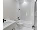 Bathroom with white marbled tile, a shower and bath, and a vanity sink at 37 Deer Canyon Dr, Auburn, GA 30011