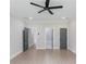 Bedroom with three interior doors and recessed lighting above wood floors at 37 Deer Canyon Dr, Auburn, GA 30011