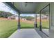 Covered patio provides outdoor relaxation with views of the lush backyard and neighboring homes in a serene setting at 37 Deer Canyon Dr, Auburn, GA 30011
