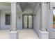 Inviting front entryway with double doors and stylish exterior lighting fixtures at 37 Deer Canyon Dr, Auburn, GA 30011