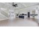 Bright, open-concept space featuring a modern kitchen and a staircase at 37 Deer Canyon Dr, Auburn, GA 30011