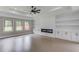 Living room with a fireplace, built-in shelves and hardwood flooring at 37 Deer Canyon Dr, Auburn, GA 30011