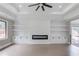Living room with custom cabinets, hardwood flooring, and a fireplace at 37 Deer Canyon Dr, Auburn, GA 30011