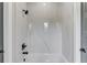 Marble-look shower and tub combo with black plumbing fixtures at 37 Deer Canyon Dr, Auburn, GA 30011