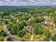 Establishing aerial shot showing the neighborhood, school, and proximity to a park at 9035 Brixham Ct, Suwanee, GA 30024