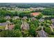 Located in a lovely residential neighborhood, the property is beautifully landscaped with mature trees at 9035 Brixham Ct, Suwanee, GA 30024