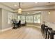 Open basement offers a bar and work space with natural light and views of the backyard at 9035 Brixham Ct, Suwanee, GA 30024