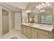 Bathroom with double vanity, framed mirror, and a glass-enclosed shower, great for relaxation at 9035 Brixham Ct, Suwanee, GA 30024