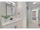 A sleek bathroom with a glass shower, modern sink, and clean design at 9035 Brixham Ct, Suwanee, GA 30024