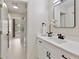 A modern bathroom with a glass shower, stylish vanity, and ample natural light at 9035 Brixham Ct, Suwanee, GA 30024