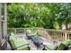 Relaxing deck with outdoor seating and views of the lush green backyard at 9035 Brixham Ct, Suwanee, GA 30024