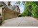 Long driveway and three car garage, great for extra parking and storage at 9035 Brixham Ct, Suwanee, GA 30024