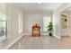 Bright home office with natural light, built-in shelving, and hardwood floors at 9035 Brixham Ct, Suwanee, GA 30024