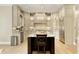 Elegant kitchen with custom cabinetry, granite countertops, and a center island at 9035 Brixham Ct, Suwanee, GA 30024