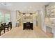 Open kitchen with custom cabinets, island, and stainless steel appliances at 9035 Brixham Ct, Suwanee, GA 30024