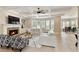 Spacious living room featuring coffered ceilings, fireplace, and large windows at 9035 Brixham Ct, Suwanee, GA 30024