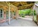 Covered patio provides a cool, shaded retreat with access to the lush backyard at 9035 Brixham Ct, Suwanee, GA 30024