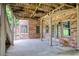 Covered patio with brick columns offers a shaded outdoor space with access to the backyard at 9035 Brixham Ct, Suwanee, GA 30024