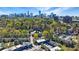 Beautiful aerial view featuring city skyline, lush trees and condominium complex at 13 Ivy Ne Sq, Atlanta, GA 30342