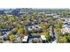 Scenic view of the condos with lush trees and a picturesque city skyline backdrop at 13 Ivy Ne Sq, Atlanta, GA 30342