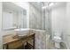 Bathroom featuring a wood vanity and a shower/tub combo with a glass enclosure at 13 Ivy Ne Sq, Atlanta, GA 30342