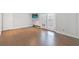 Bedroom with hardwood floors, closet, and French doors to the balcony at 13 Ivy Ne Sq, Atlanta, GA 30342