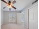 Bedroom with large ceiling fan and natural light from the large window at 13 Ivy Ne Sq, Atlanta, GA 30342
