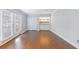 Bedroom with hardwood floors, closet, and French doors to the balcony at 13 Ivy Ne Sq, Atlanta, GA 30342