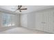Bright bedroom featuring large windows and double closets at 13 Ivy Ne Sq, Atlanta, GA 30342