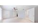 Spacious bedroom with carpet, ceiling fan, and access to an ensuite bathroom at 13 Ivy Ne Sq, Atlanta, GA 30342