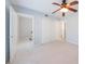Bedroom with neutral carpet, closet and access to another room at 13 Ivy Ne Sq, Atlanta, GA 30342