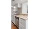 Bright kitchen with granite countertops, stainless steel appliances and gray backsplash at 13 Ivy Ne Sq, Atlanta, GA 30342