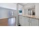 Open-concept kitchen and living area with granite countertops, stainless steel appliances, and hardwood floors, ideal for entertaining at 13 Ivy Ne Sq, Atlanta, GA 30342
