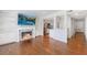Living room with fireplace, built in shelves, and open access to the kitchen at 13 Ivy Ne Sq, Atlanta, GA 30342